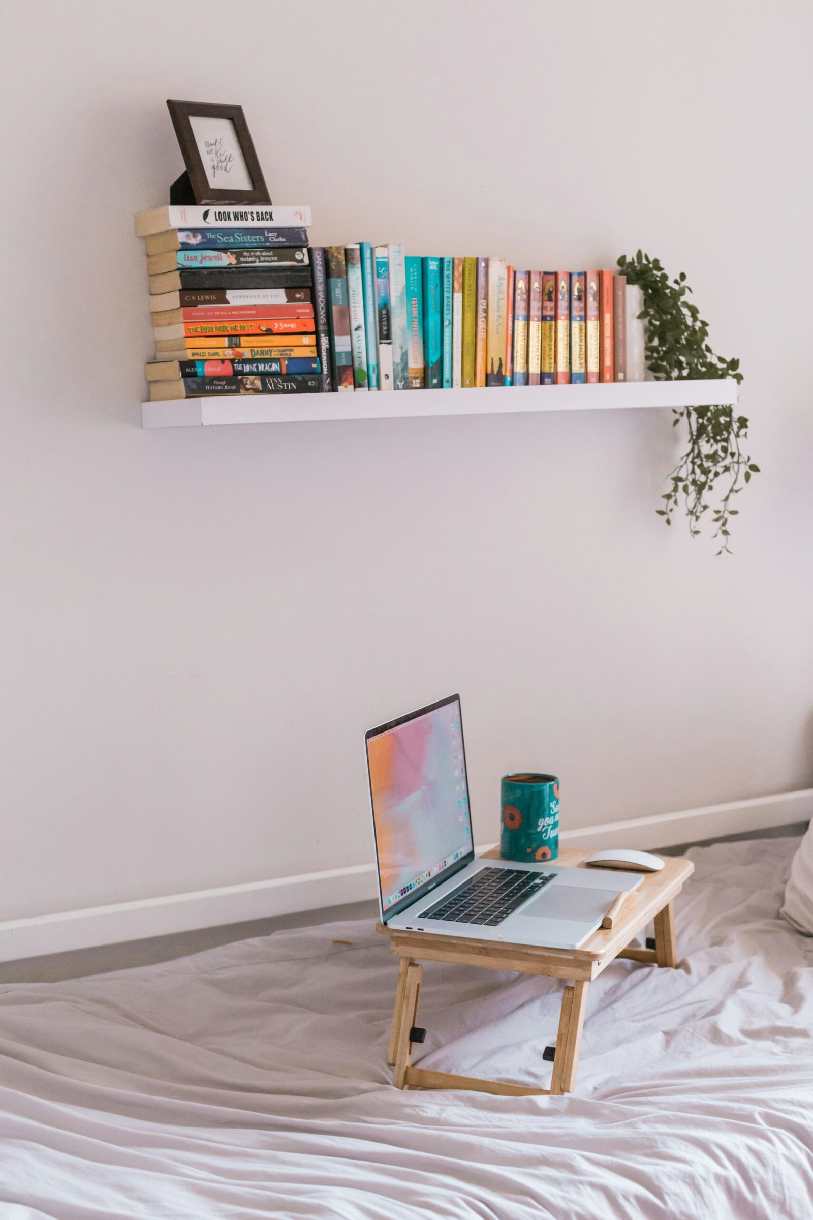 macbook pro on white wooden table